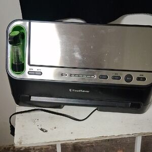 Vacuum Sealer with Green and Black Accents